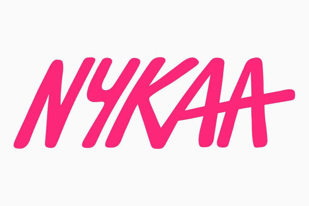 Nykaa logo with a bold and stylish handwritten font in pink, symbolizing beauty and empowerment