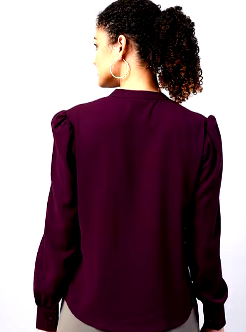 FITHUB 4 Back view of a woman wearing a plum blouse with puffed sleeves and a smooth finish.