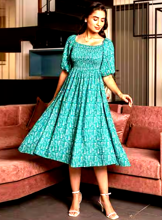 STAR WORD 3 Woman twirling in a teal smocked midi dress with puffed sleeves and a flowy skirt.