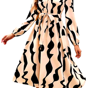 A full view of a woman wearing a beige midi dress by Leriya Fashion, with black abstract patterns, long sleeves, and a tie belt at the waist. She poses elegantly with flowing fabric.