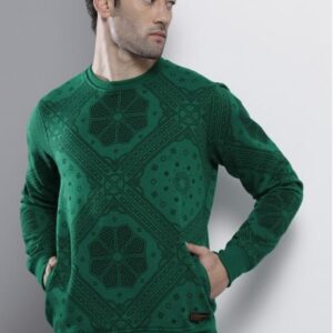 Man wearing a green printed sweatshirt with geometric patterns