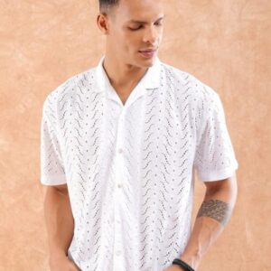 Model wearing a white short-sleeve shirt with a subtle pattern, displaying the front view and a relaxed posture