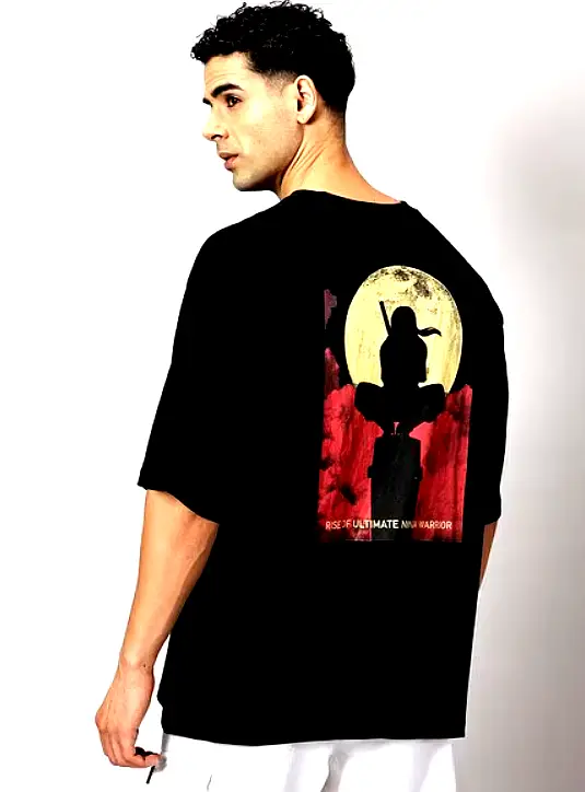 THE HOLLANDER 5 Back view of a man wearing a black oversized T-shirt with a graphic print of a ninja warrior silhouette against a blood moon backdrop.
