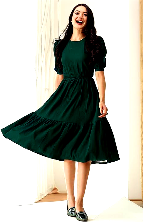 Istyle 3 A woman in an elegant dark green midi dress with puff sleeves, styled by Istyle, twirling gracefully in a bright room.