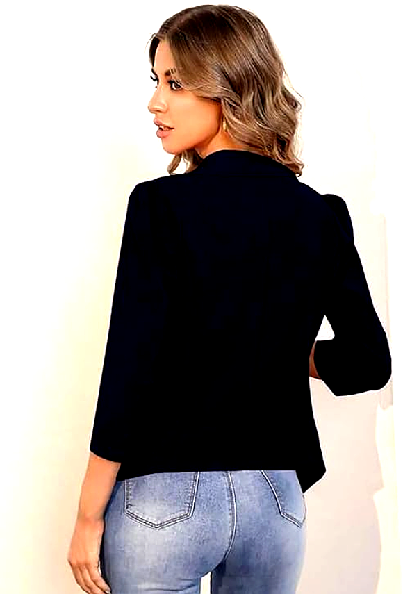 KOTTY 4 Back view of a woman wearing a Kotty navy blue blazer, highlighting its seamless stitching and structured fit.