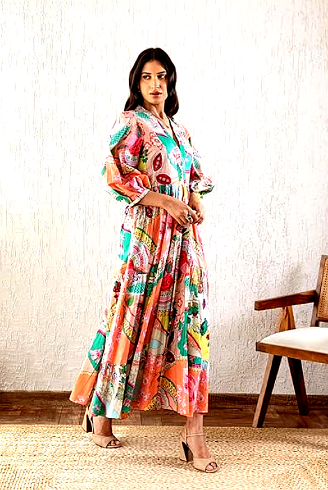GRECIILOOKS 3 A woman wearing a vibrant GRECIILOOKS printed maxi dress with balloon sleeves and a flowing silhouette.