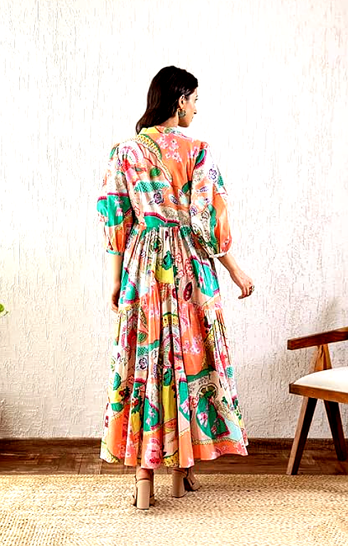 GRECIILOOKS 4 Back view of a woman wearing a GRECIILOOKS printed maxi dress, highlighting the elastic waist and elegant flow.