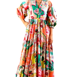 A woman confidently posing in a GRECIILOOKS printed maxi dress with puff sleeves and a vibrant design.