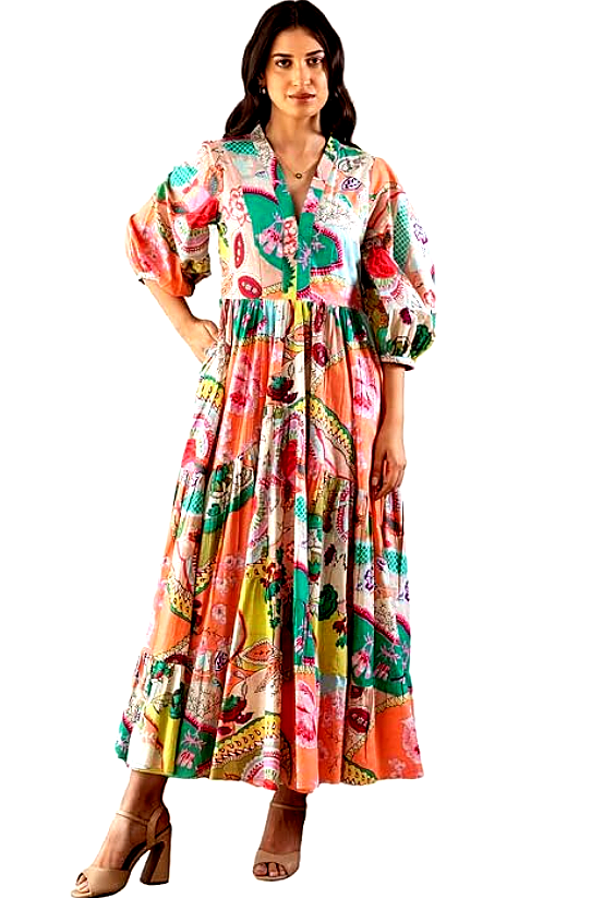 GRECIILOOKS 5 A woman confidently posing in a GRECIILOOKS printed maxi dress with puff sleeves and a vibrant design.