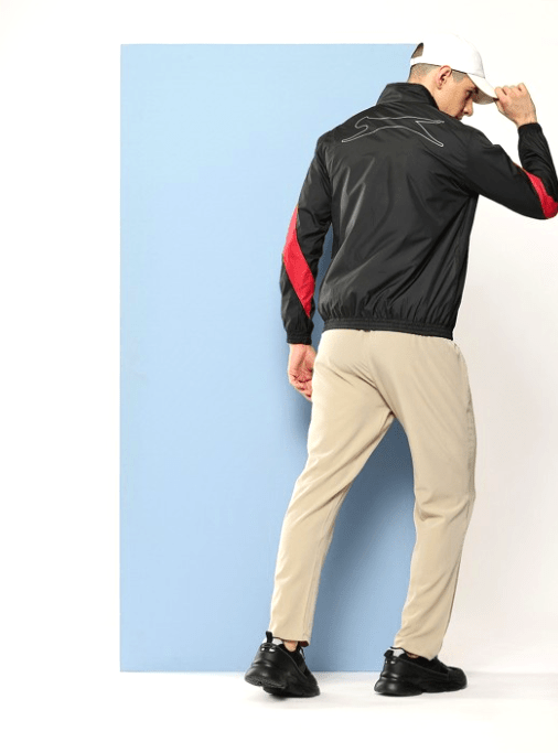 Men's jacket for winter 5 Back view of a black Slazenger jacket with red stripe accents and a sleek athletic design.