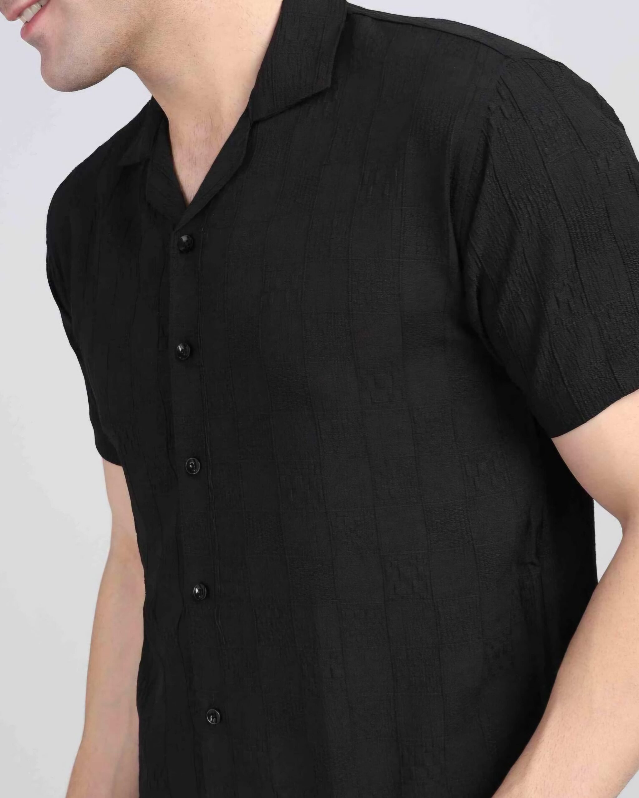 SILVERFLY 4 Close-up of men's casual black shirt textured shirt with a button-down design and relaxed collar, highlighting the fabric details.