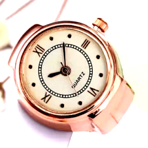 Yellow Chimes rose gold ring watch with a white dial and Roman numeral markers.