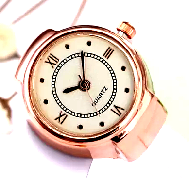 YELLOW CHIMES (women) 3 Yellow Chimes rose gold ring watch with a white dial and Roman numeral markers.